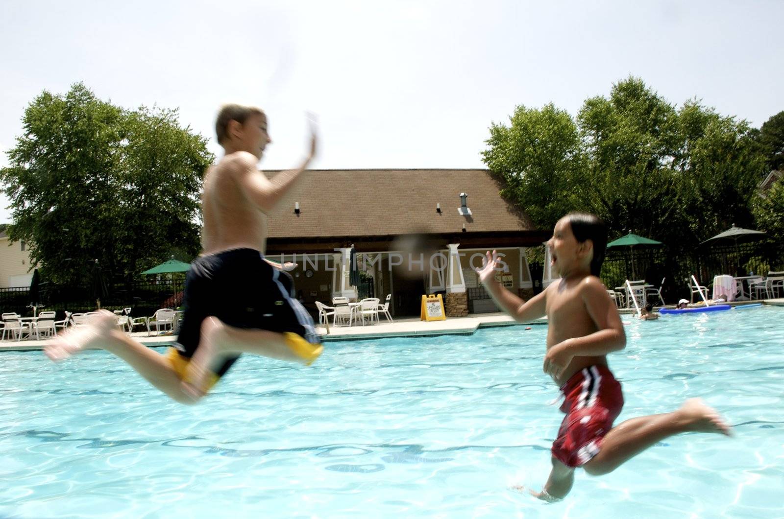 Friends playing at the pool