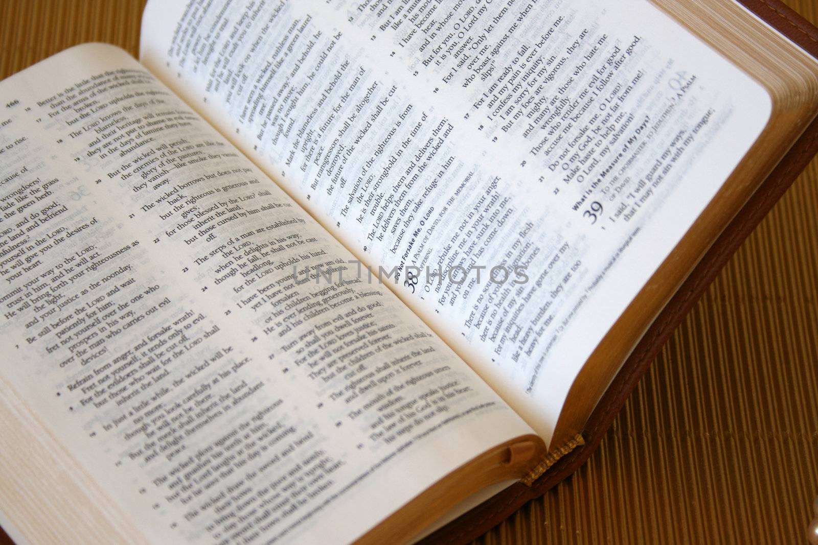 Leather bound bible opened at a piece of scripture