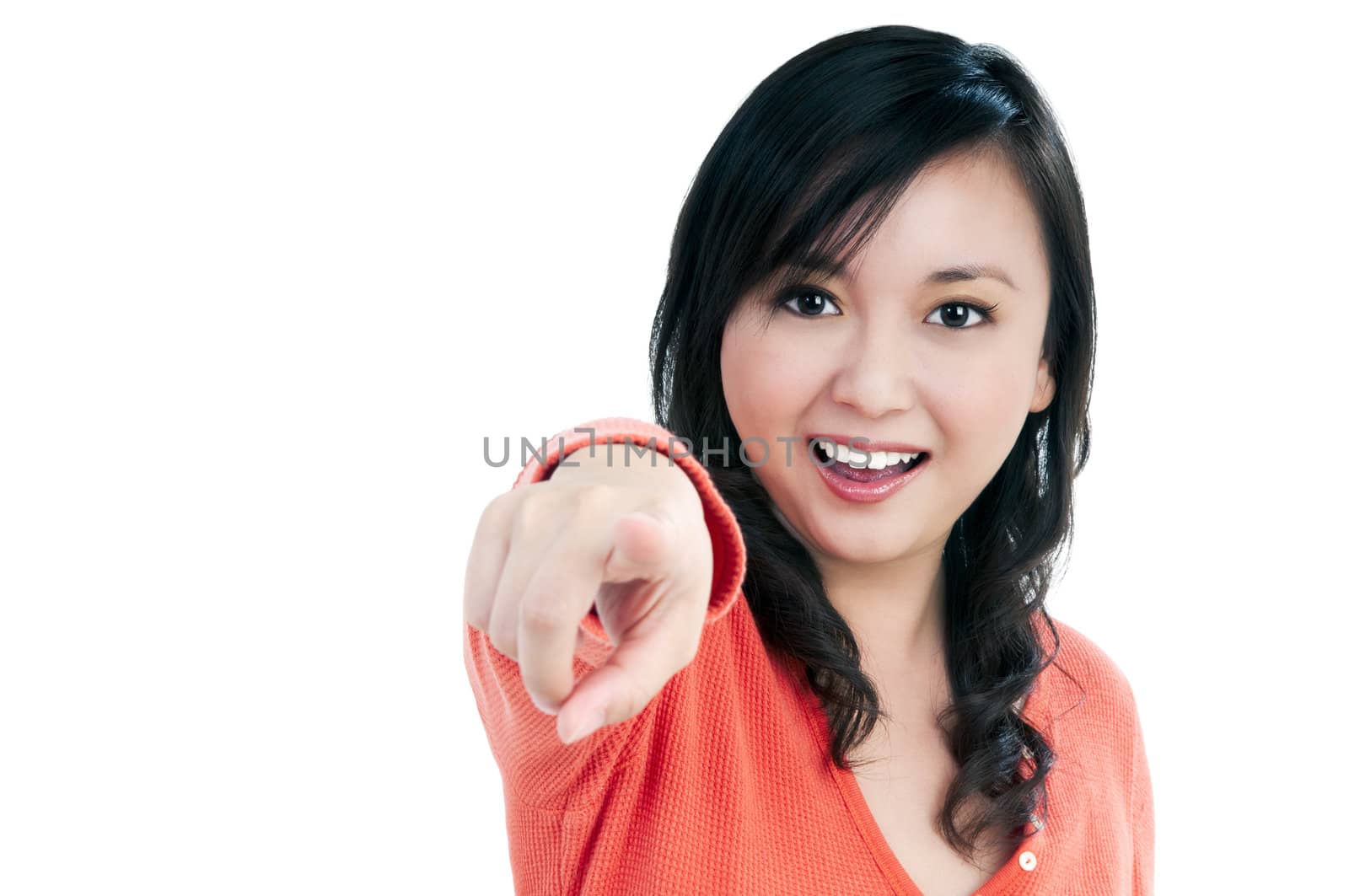 Portrait of an attractive young woman pointing, isolated on white.