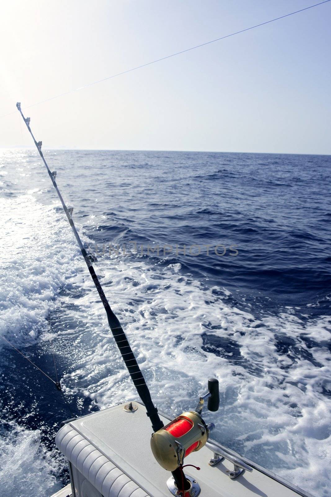 Fishing big game on Mediterranean sea boat with rod and reel