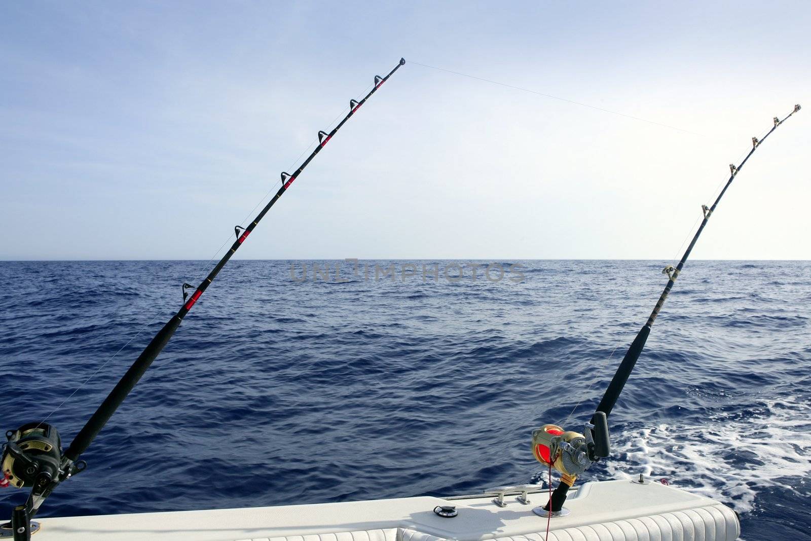 Fishing boat with rod and reel by lunamarina