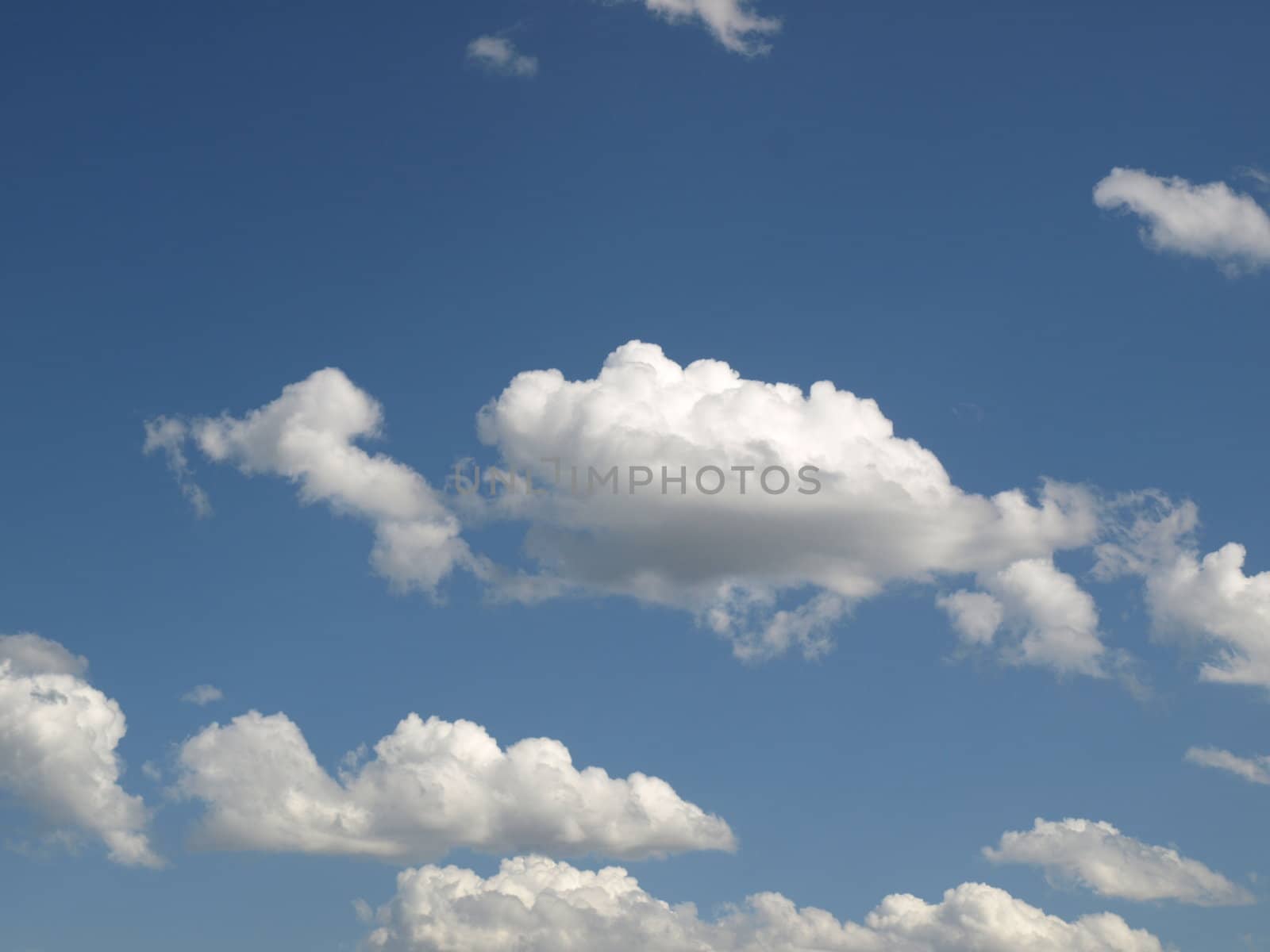 Blue sky with white clouds useful as a background