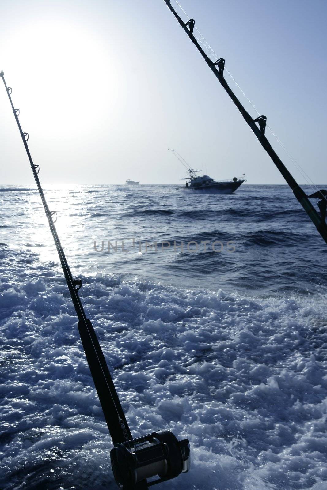 Fishing Mediterranean sea boat with two rods by lunamarina