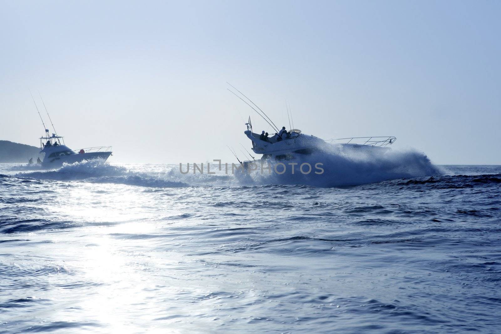 Fishing boat in a big game summer blue morning in Mediterranean sea