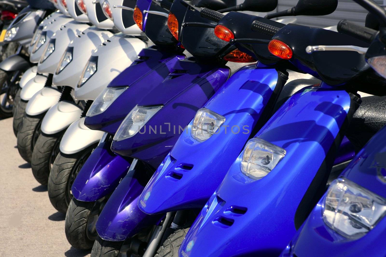 Scooter motorbikes in a row with perspective line