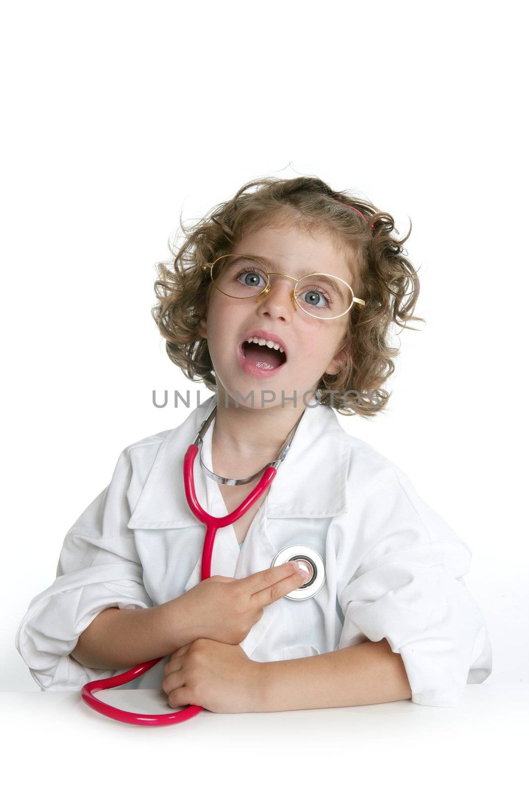 Cute little girl pretending to be a doctor with stethoscope over white