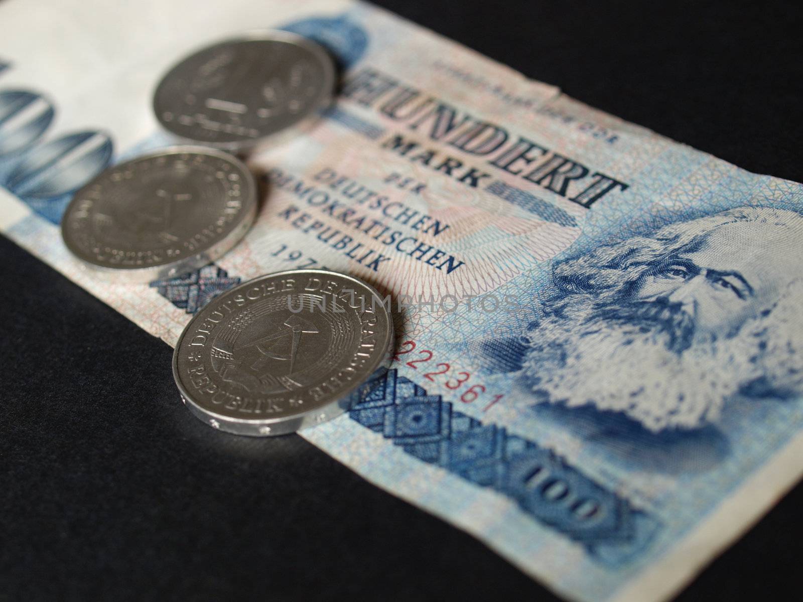 100 Mark banknote from the DDR (East Germany) with Karl Marx with 1 Mark coin - Note: no more in use since german reunification in 1989