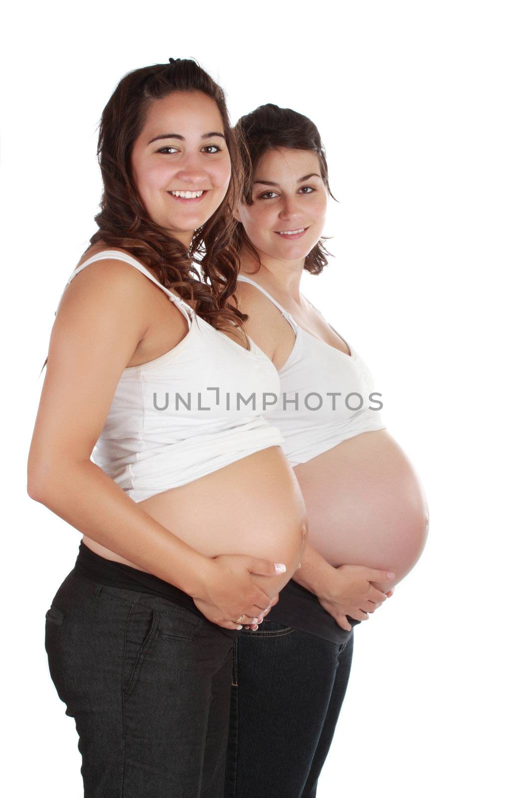 two pregnant sisters isolated on white background
