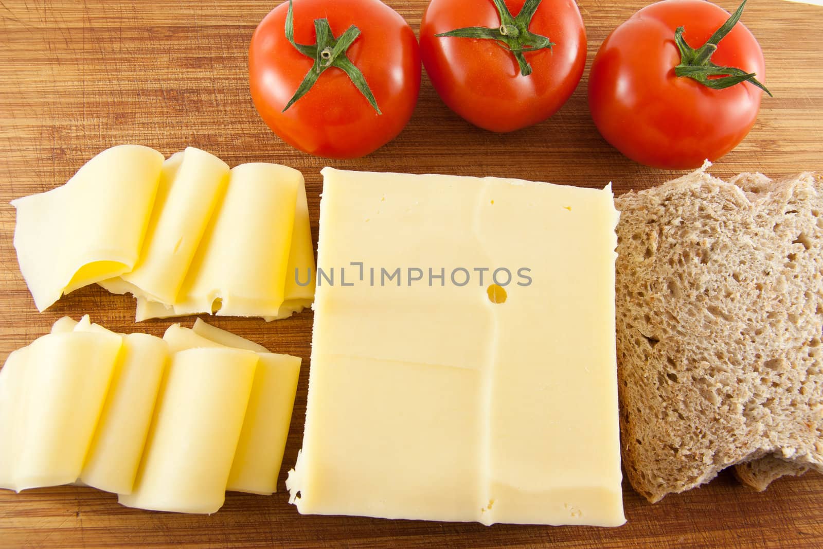 Picture of a plate with cheese tomatoe and some bread