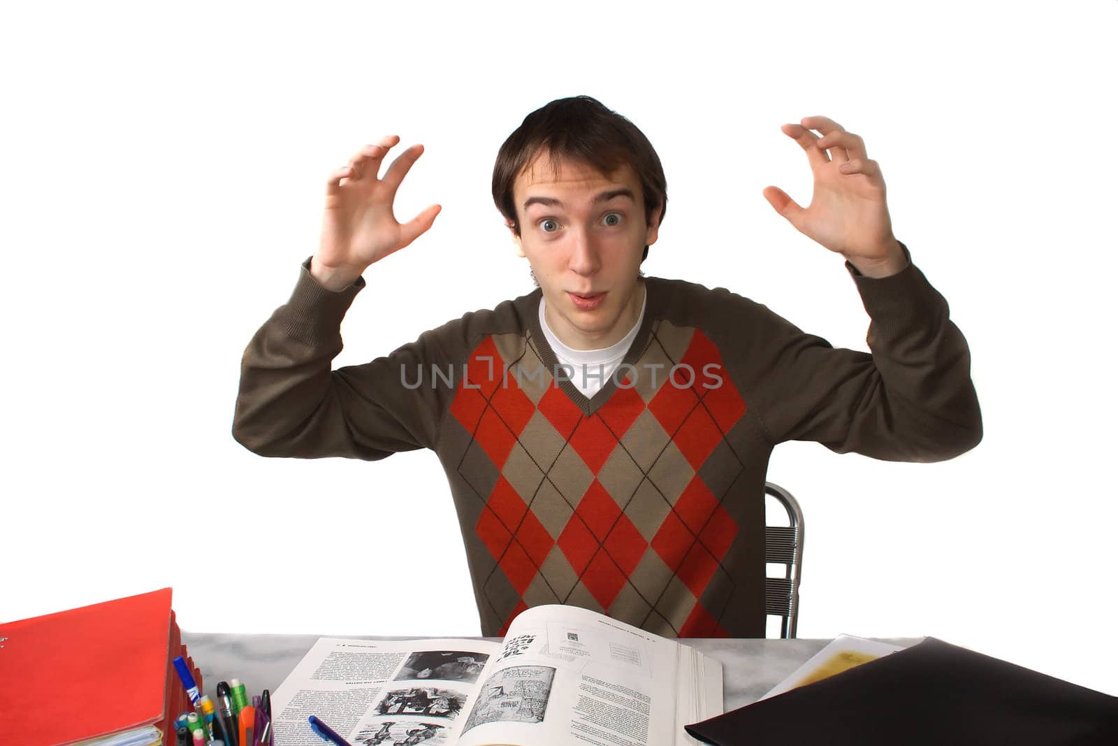 Male student at a table, overwhelmed