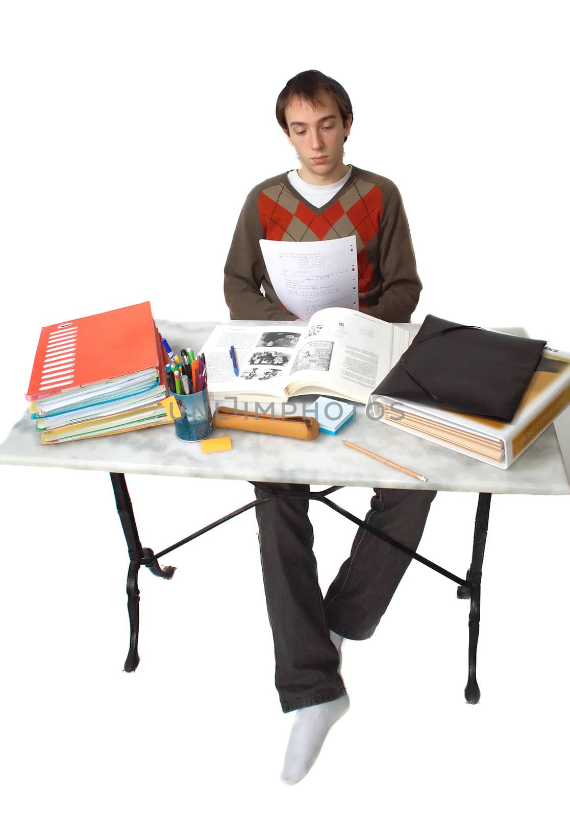 Male student at a table, general view