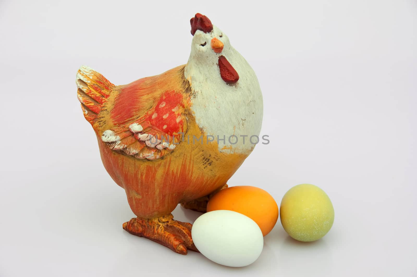 A decorative hen with eggs. Isolated.