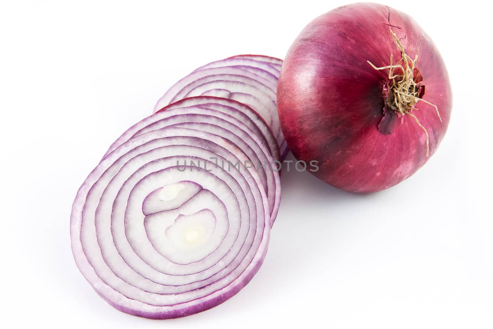 Picture of a red onion sliced up and a whole one