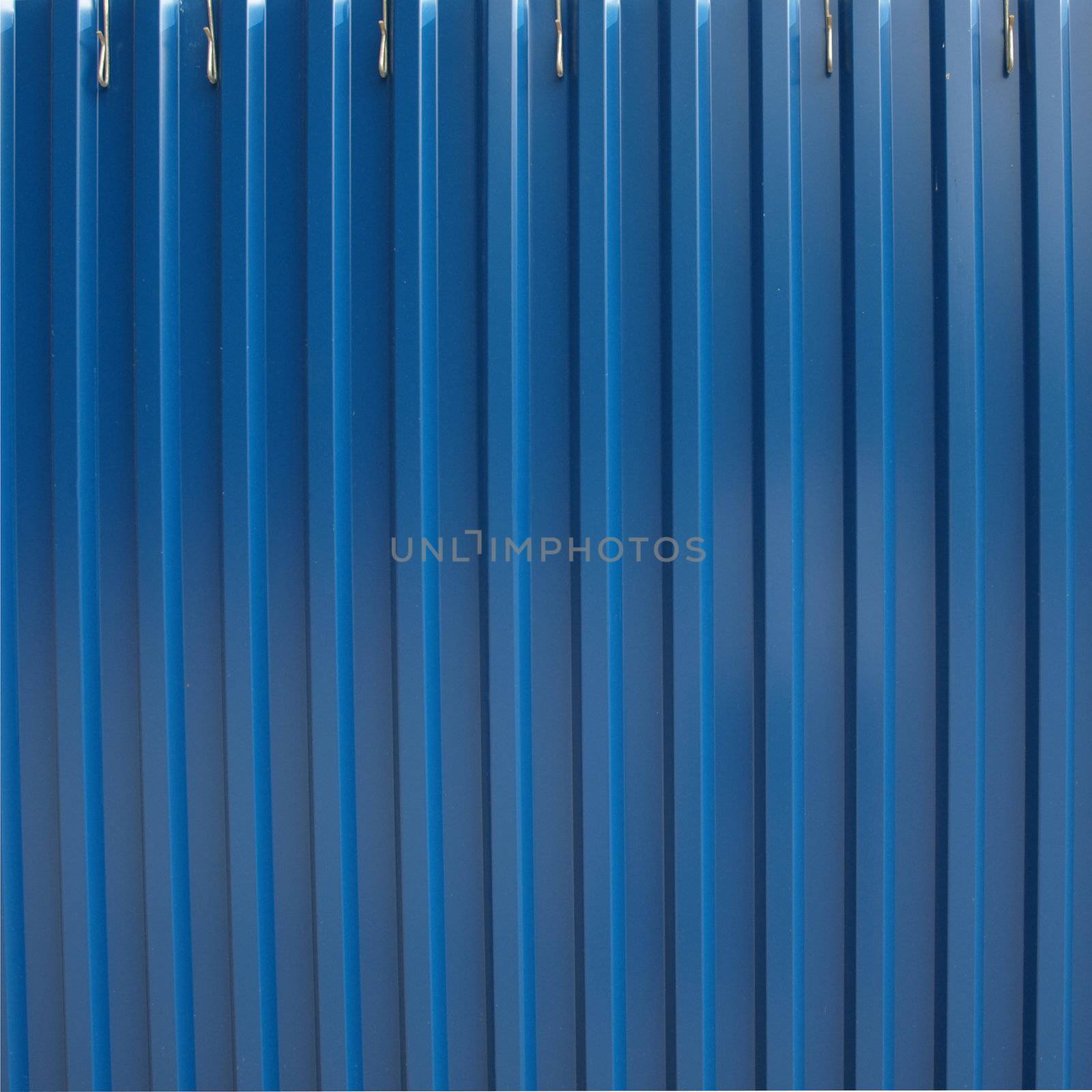 Corrugated steel sheet useful as a background