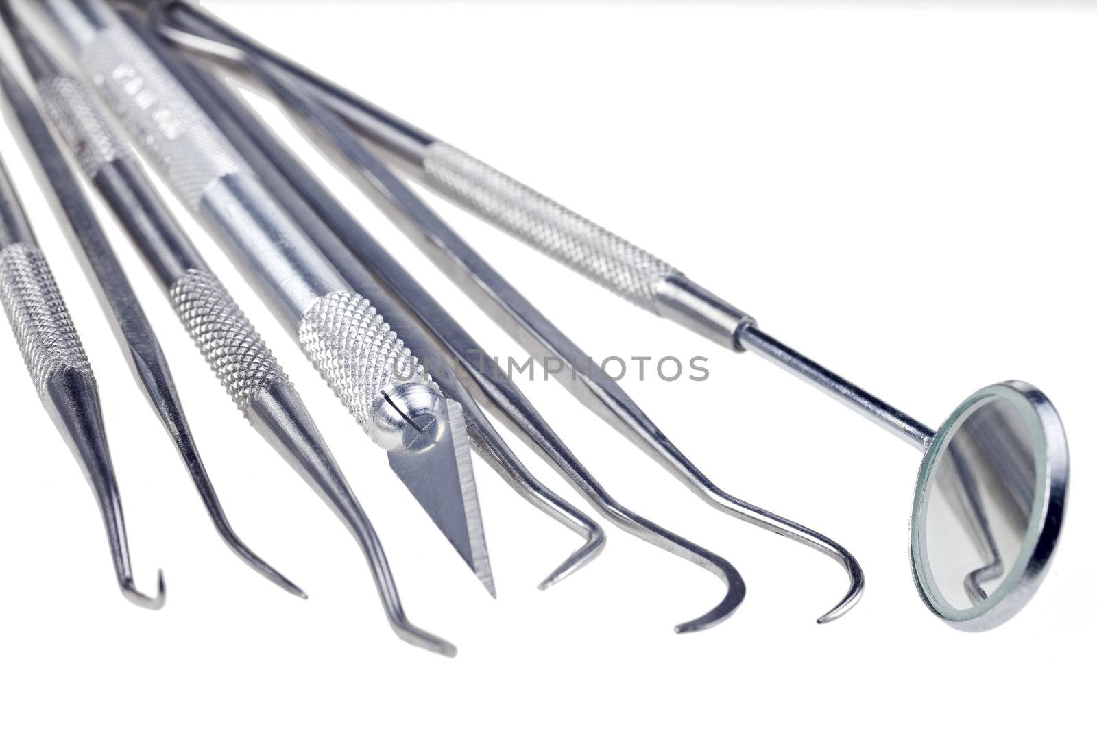 dentists tools isolated on a white background by bernjuer