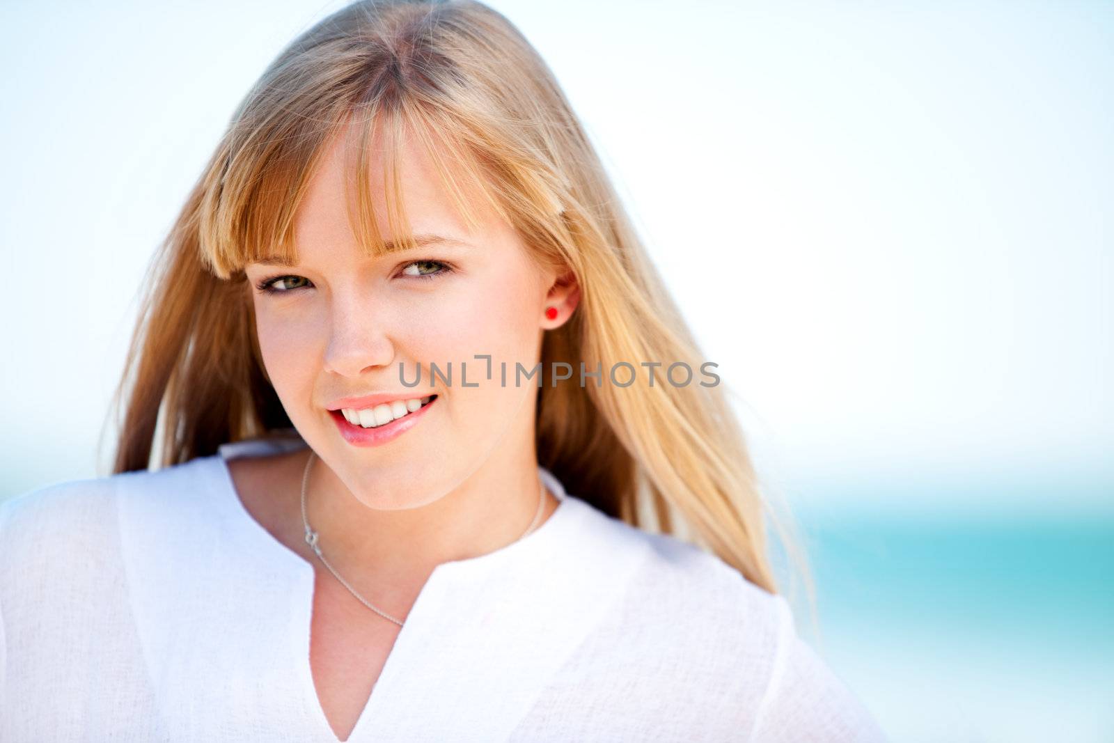 Face of a young girl on a beach