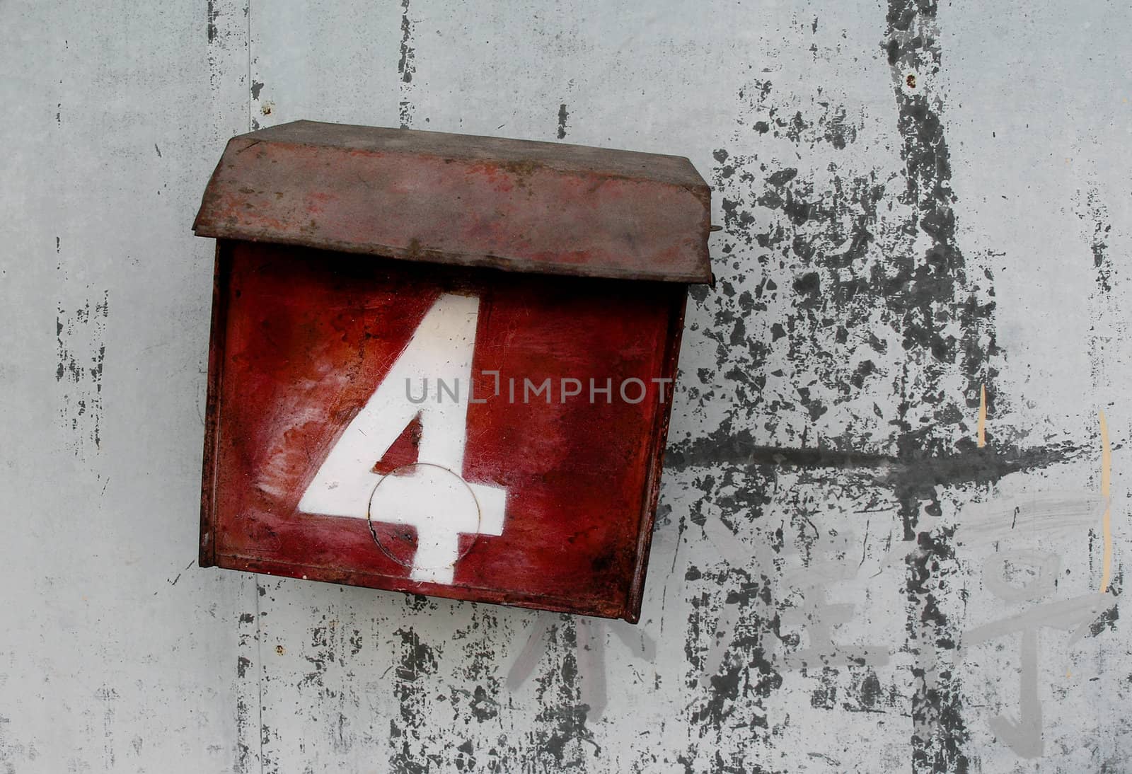 old tin box on a old wall    