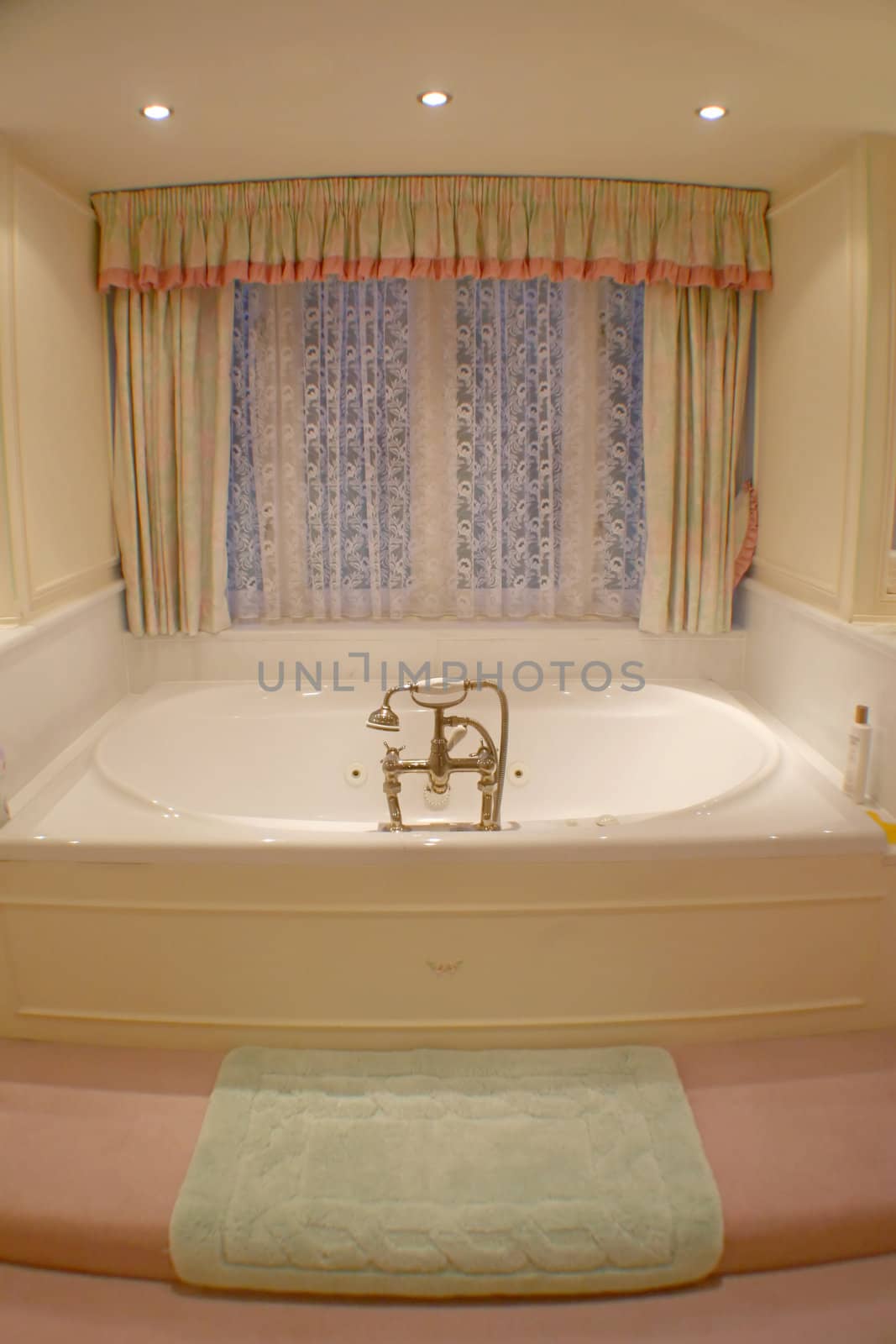 A photo of a bath tub in a bathroom.