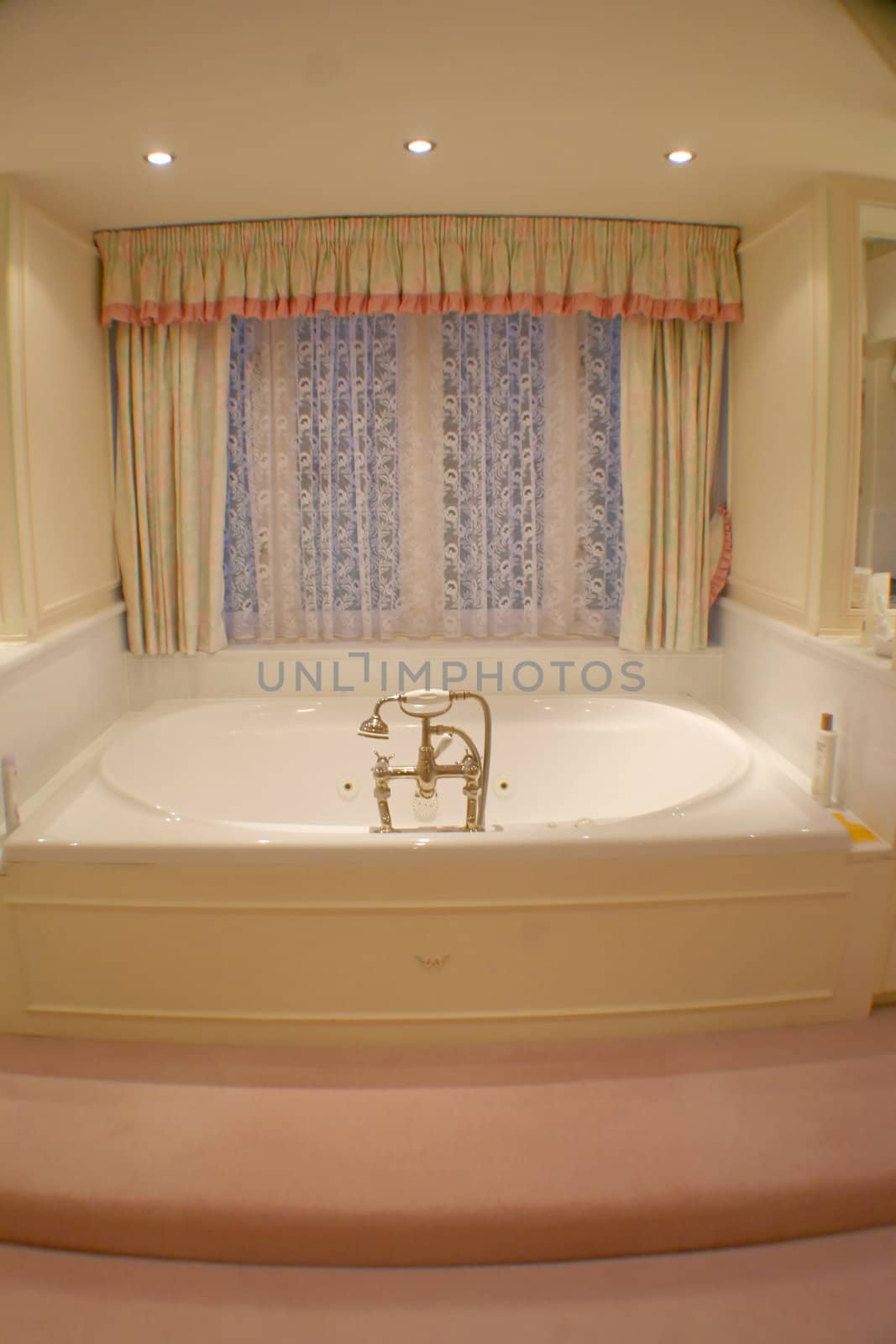 A photo of a bath tub in a bathroom.