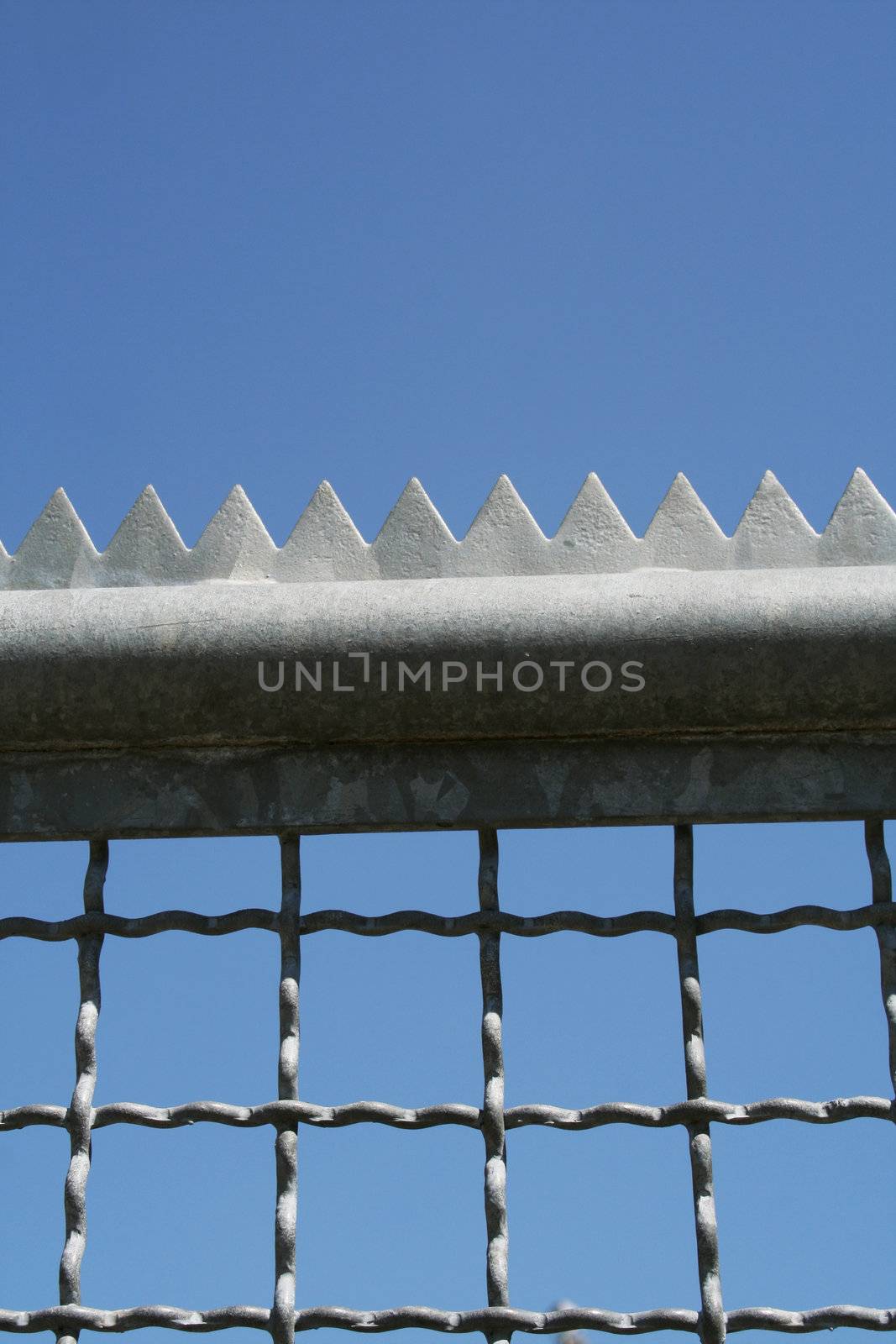 metal fence with with edges and tines