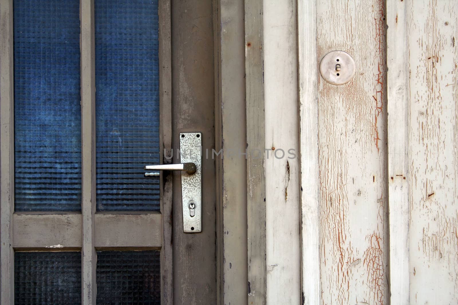 entrance with door handle of an old wooden house