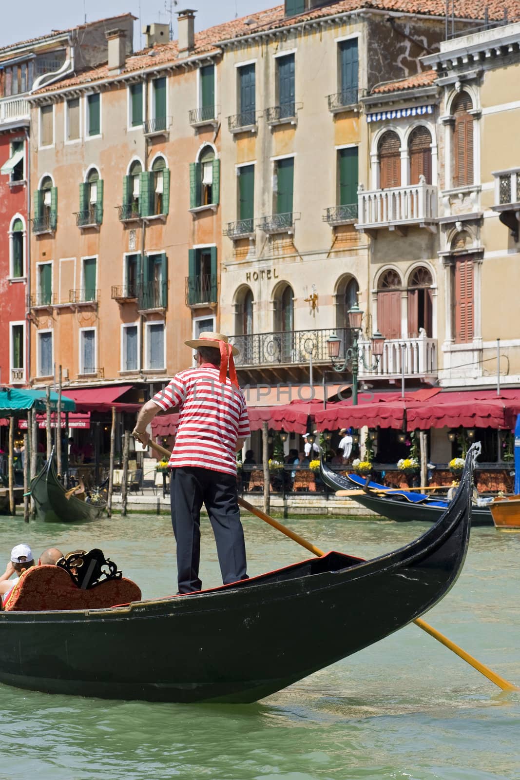 Gondola in the Grand Canal of Venice, Italy by stockbymh