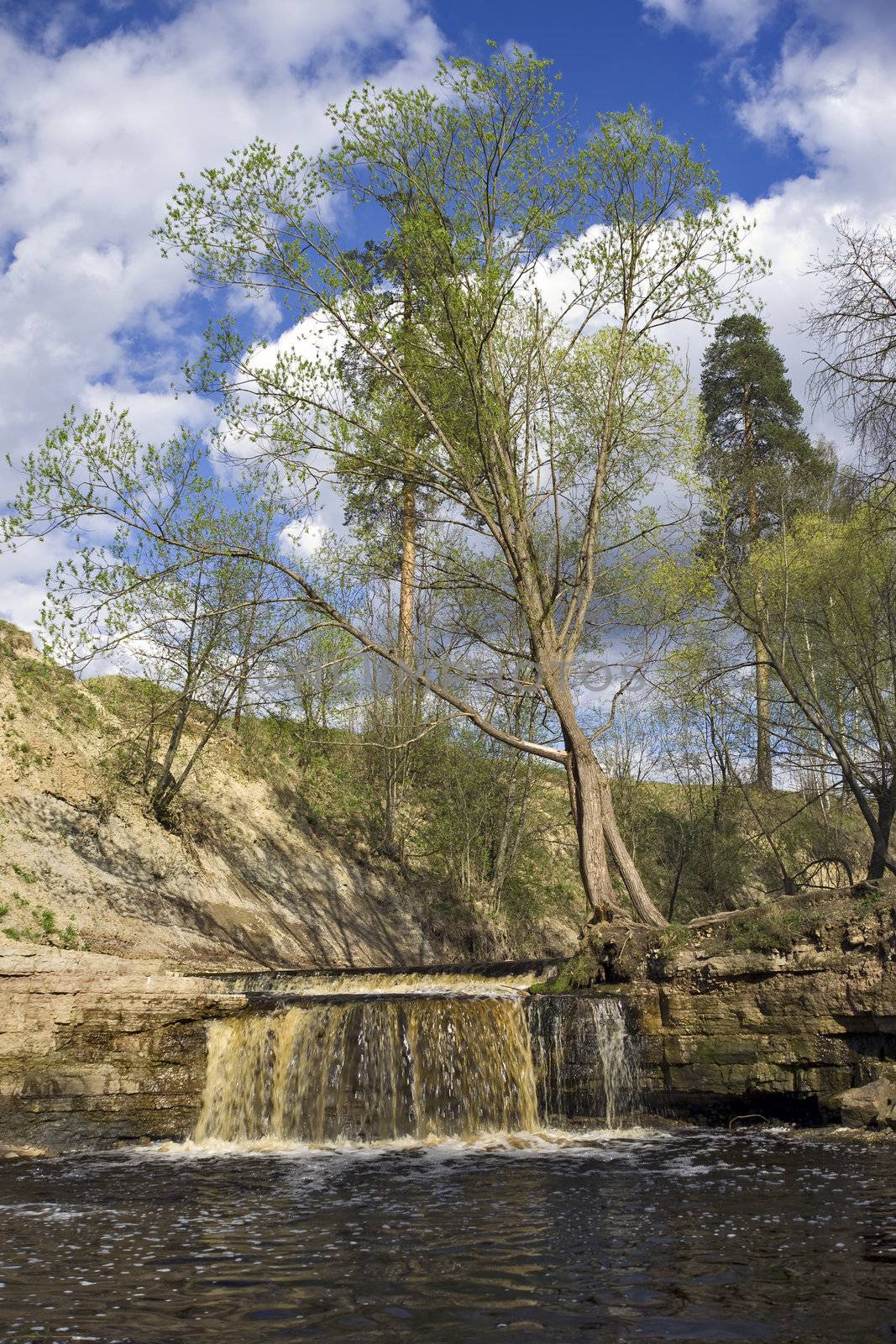 Small waterfall of spring river