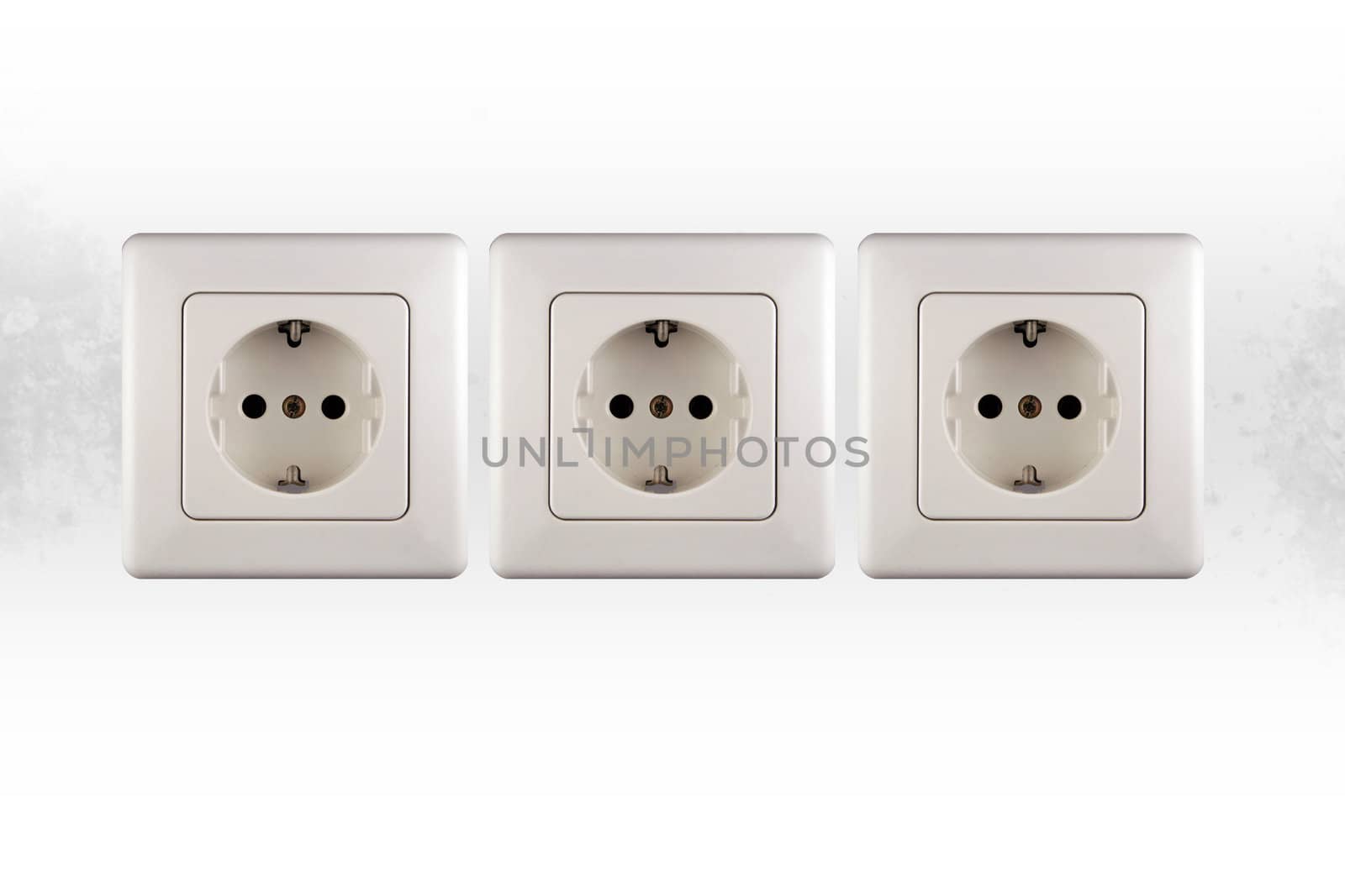 three little sockets of electricity in a wall
