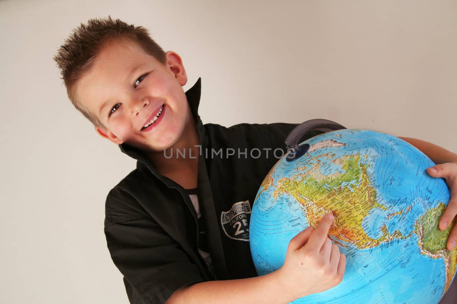 Boy is holding the world in his hands