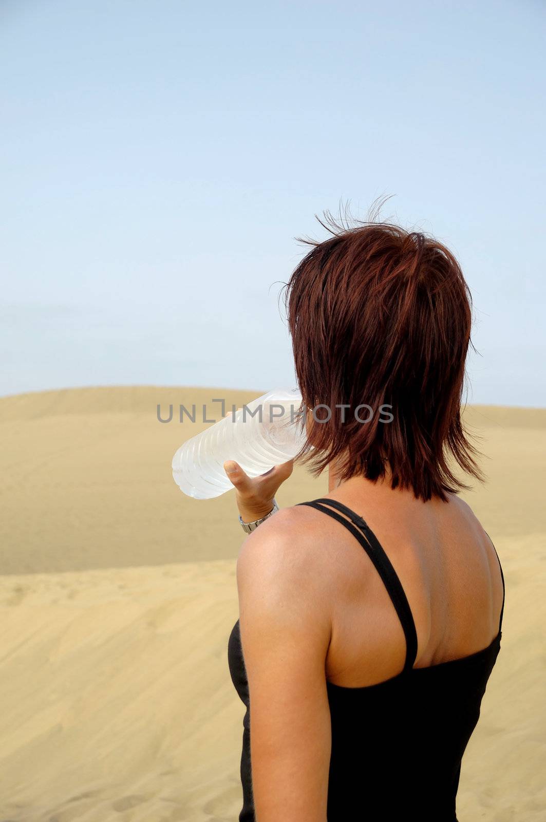 Woman drinking water by cfoto