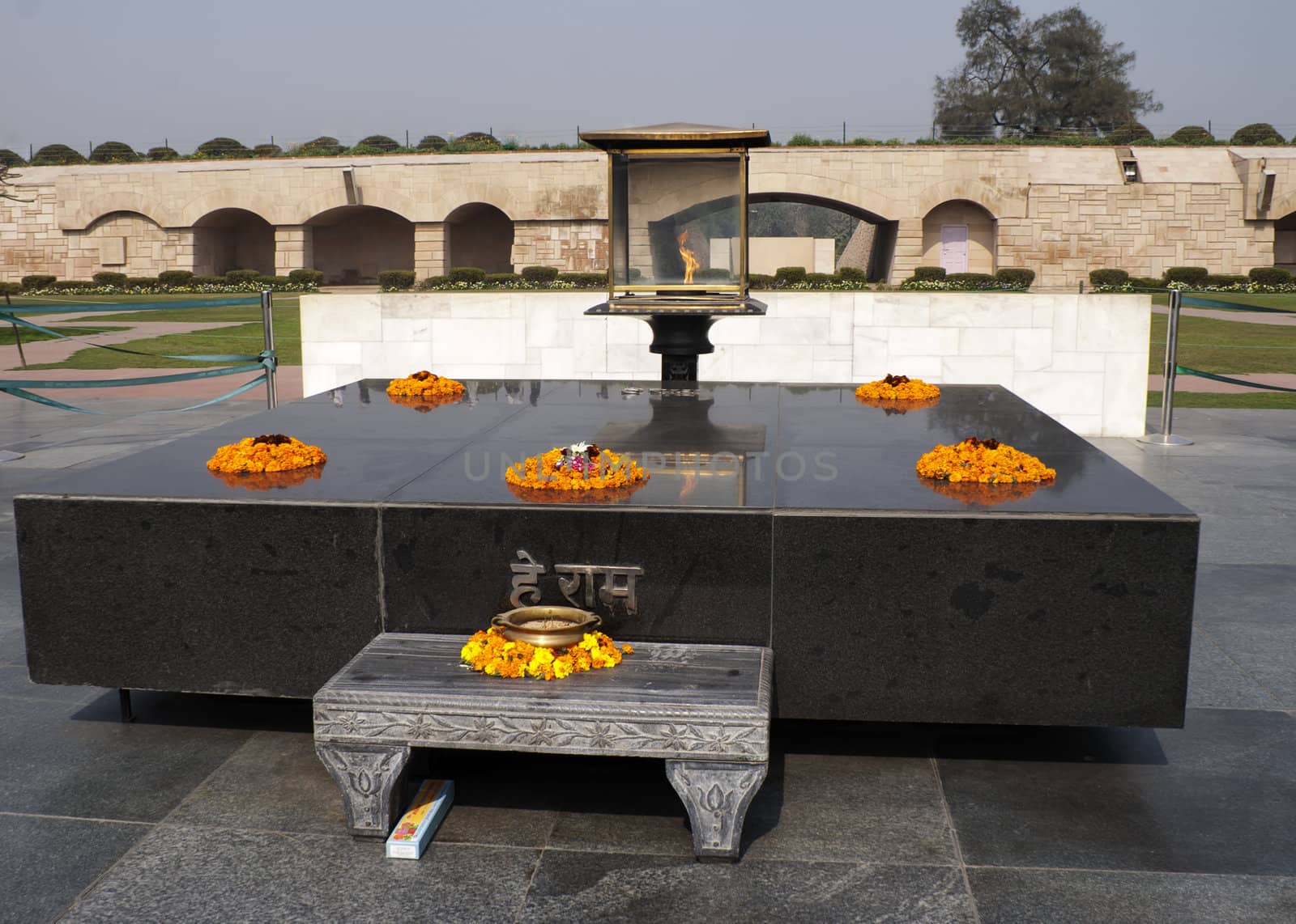 Altar like platform with eternal flame on the spot where Gandhi was cremated. by Claudine