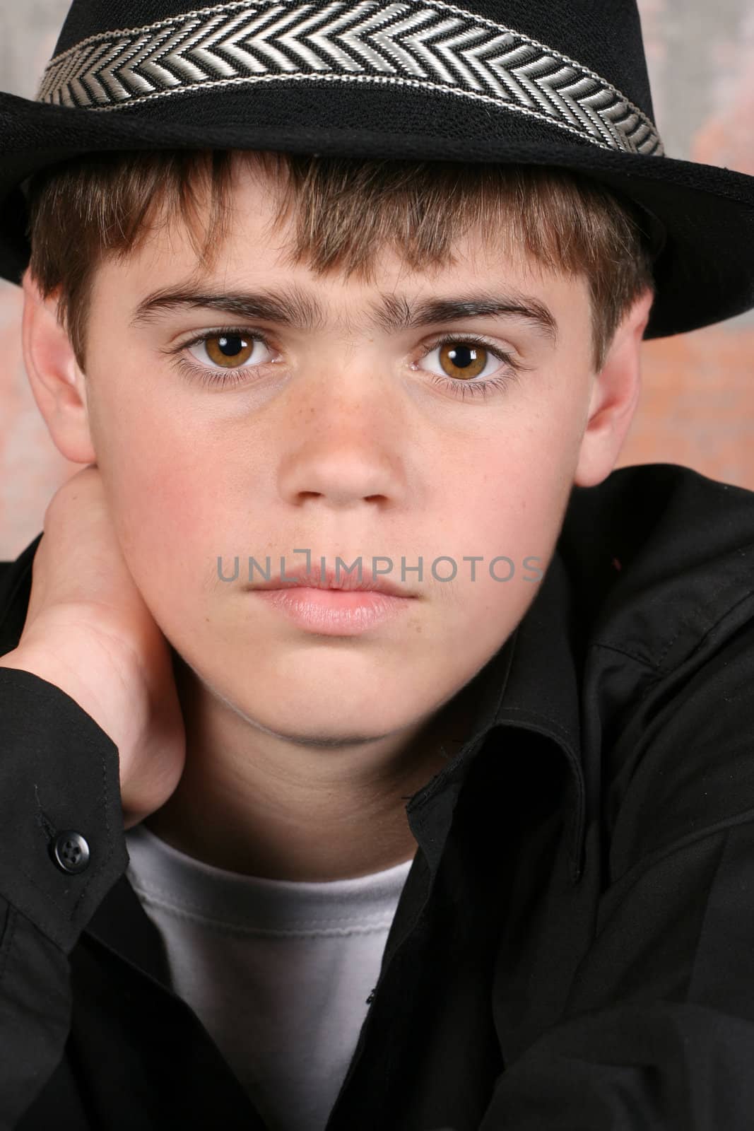 Teenage boy wearing a black hat in casual wear