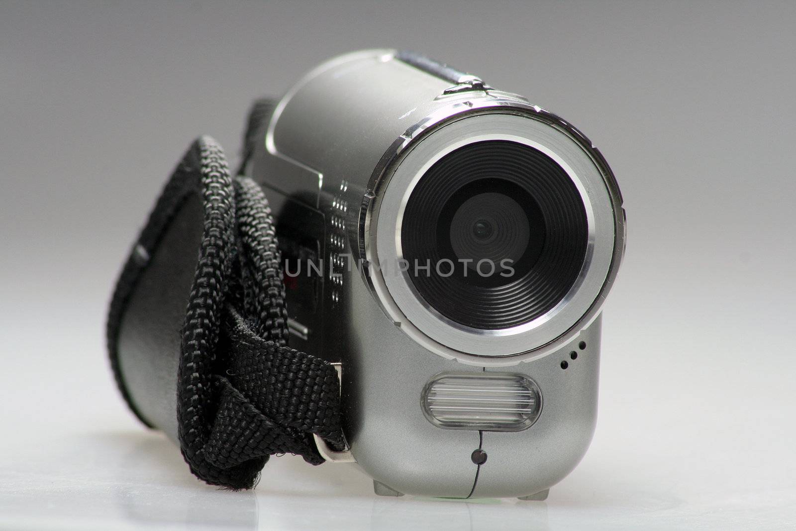 Small silver digital Camera with flashlight