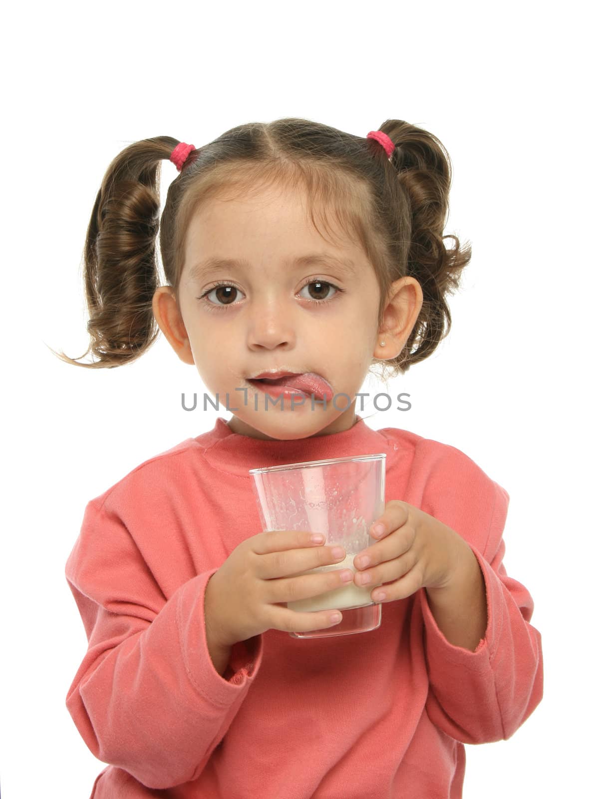 Toddler enjoying a glass of fresh milk