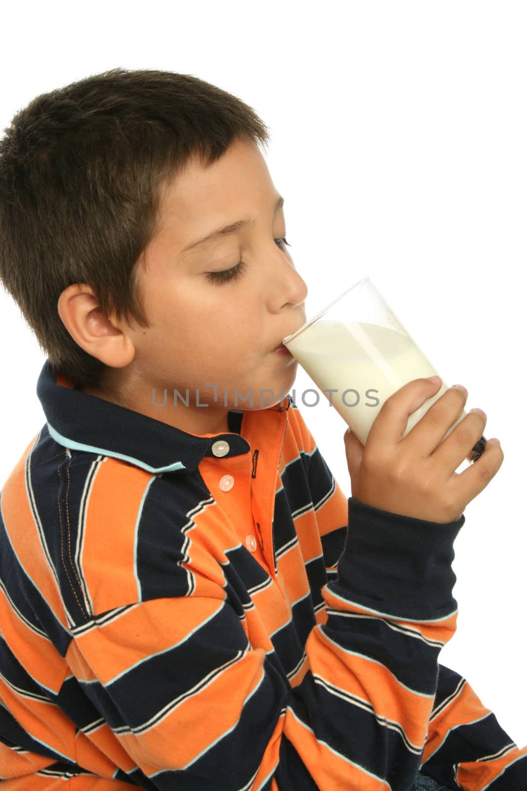 Boy drinking a glass of milk by Erdosain