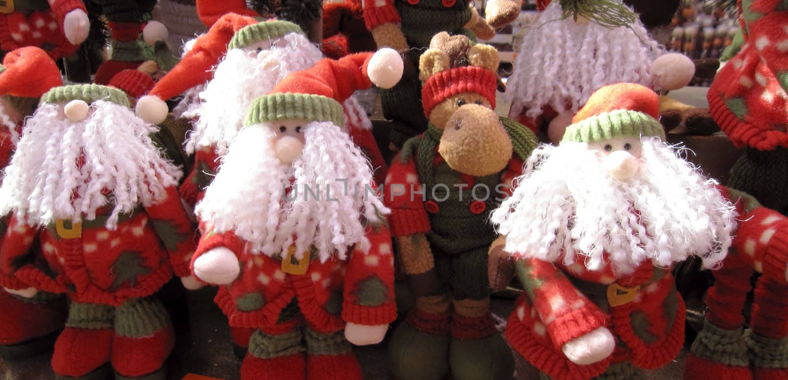 four people in santa claus look are celebrating christmas