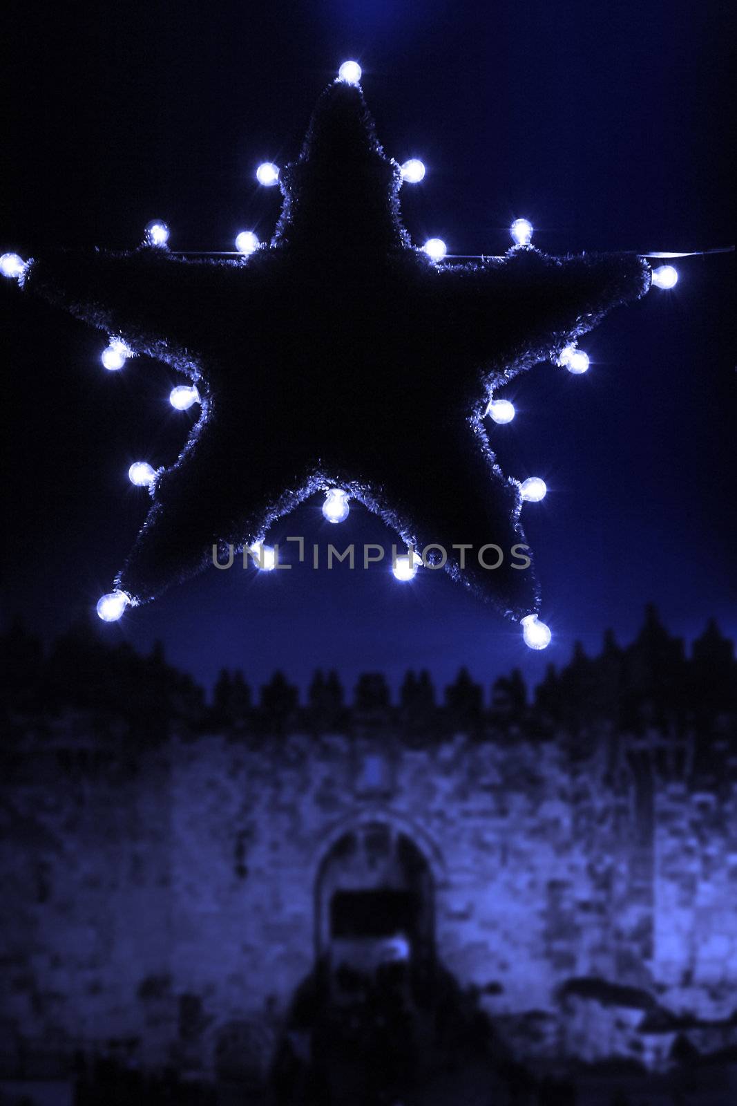 bright christmas star in the dark streets