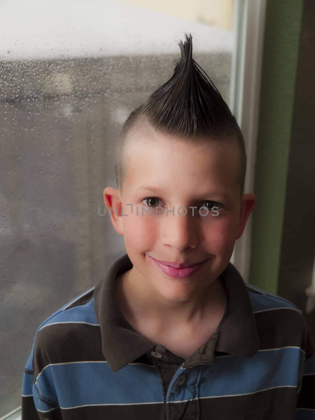 A little boy with a mohawk hair do