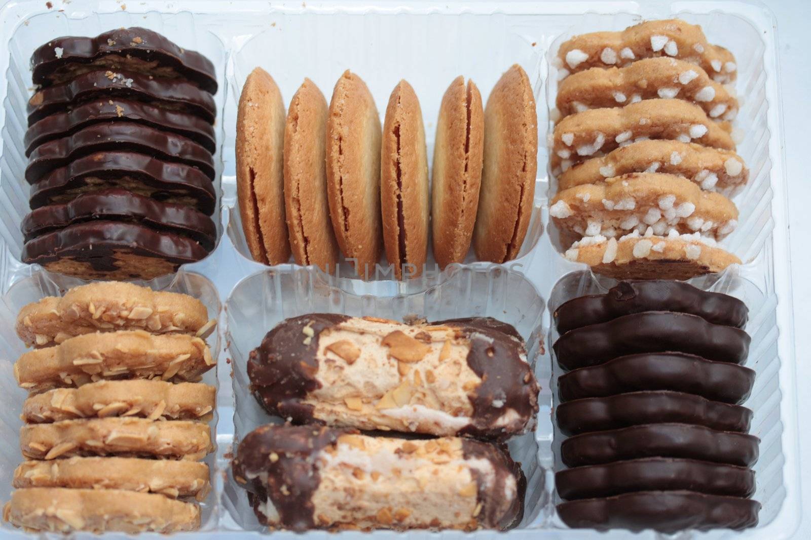 Assorted chocolate and almond cookies in a presentation box