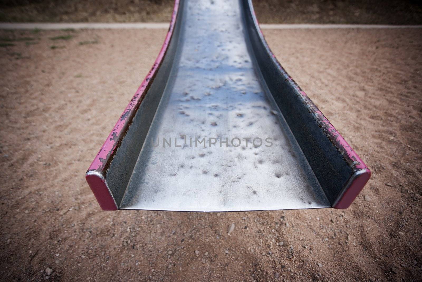 End of a battered old playgraound slide