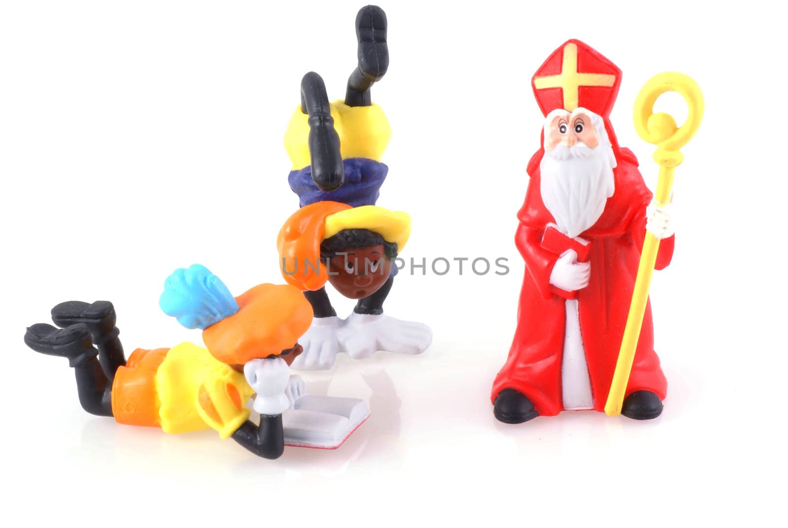 Sinterklaas and black pieten, characters from a traditional dutch holiday; isolated on white.