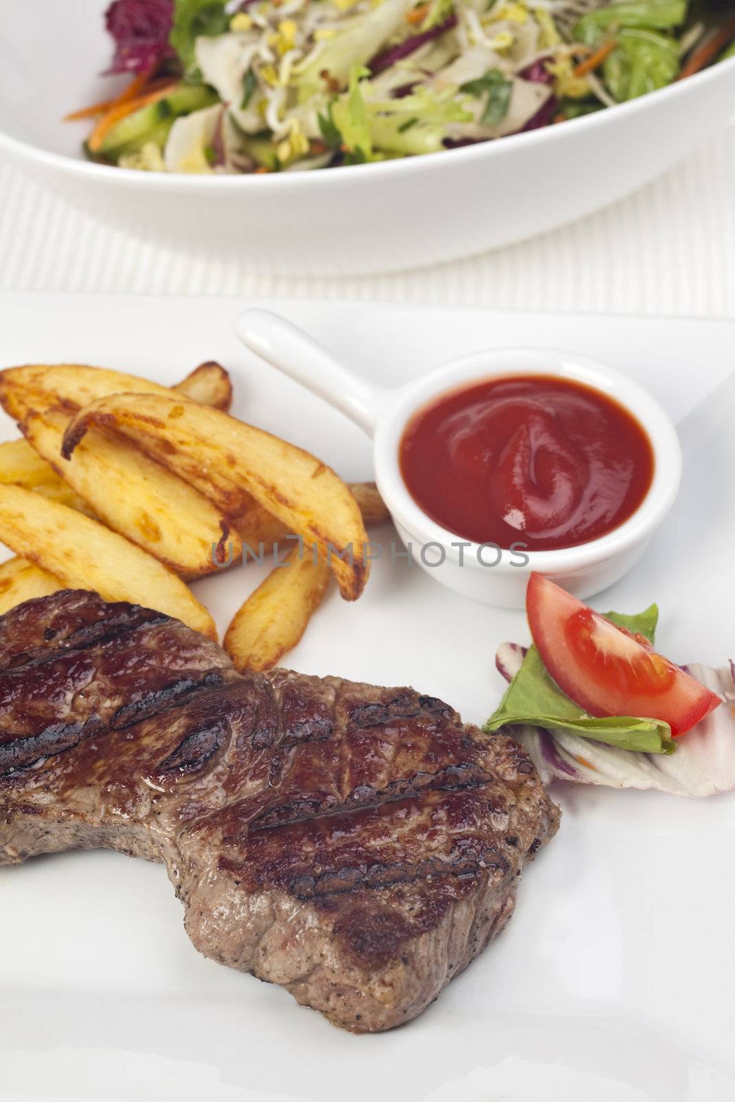 steak and french fries on a plate
