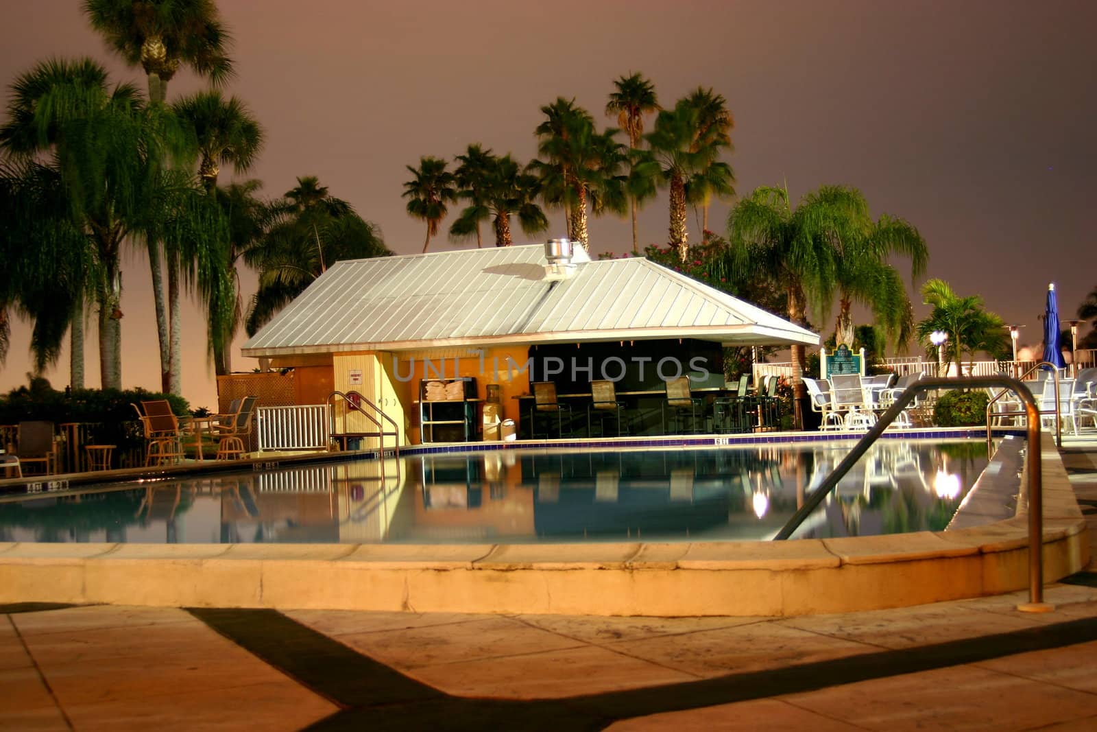 This is a view of the swimming pool and cantina bar at the Safety Harbor Resort and Spa in Safety Harbor, Florida. Shot late at night with a 15 second shutter time.  With the calm water and the heat of the Florida air, you just want to dive right in. 