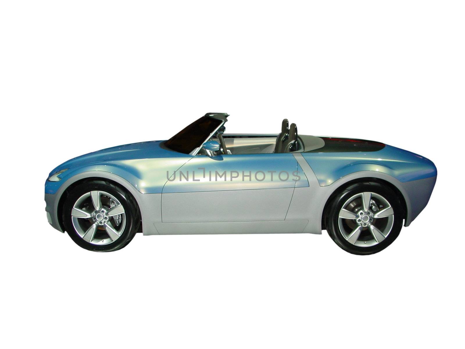 This is a picture of a small convertible concept car that was taken at an auto show isolated on white.