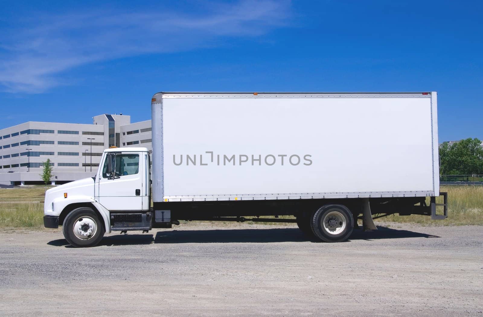 This is a picture of a typical six wheel city delivery cargo vehicle with a blank white van box.