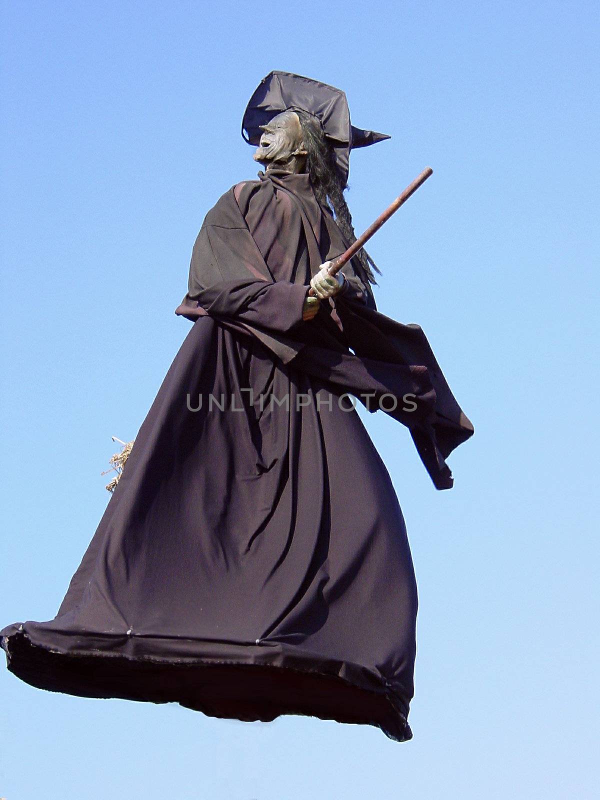 This is a wicked Halloween witch flying through the air on her broom. 