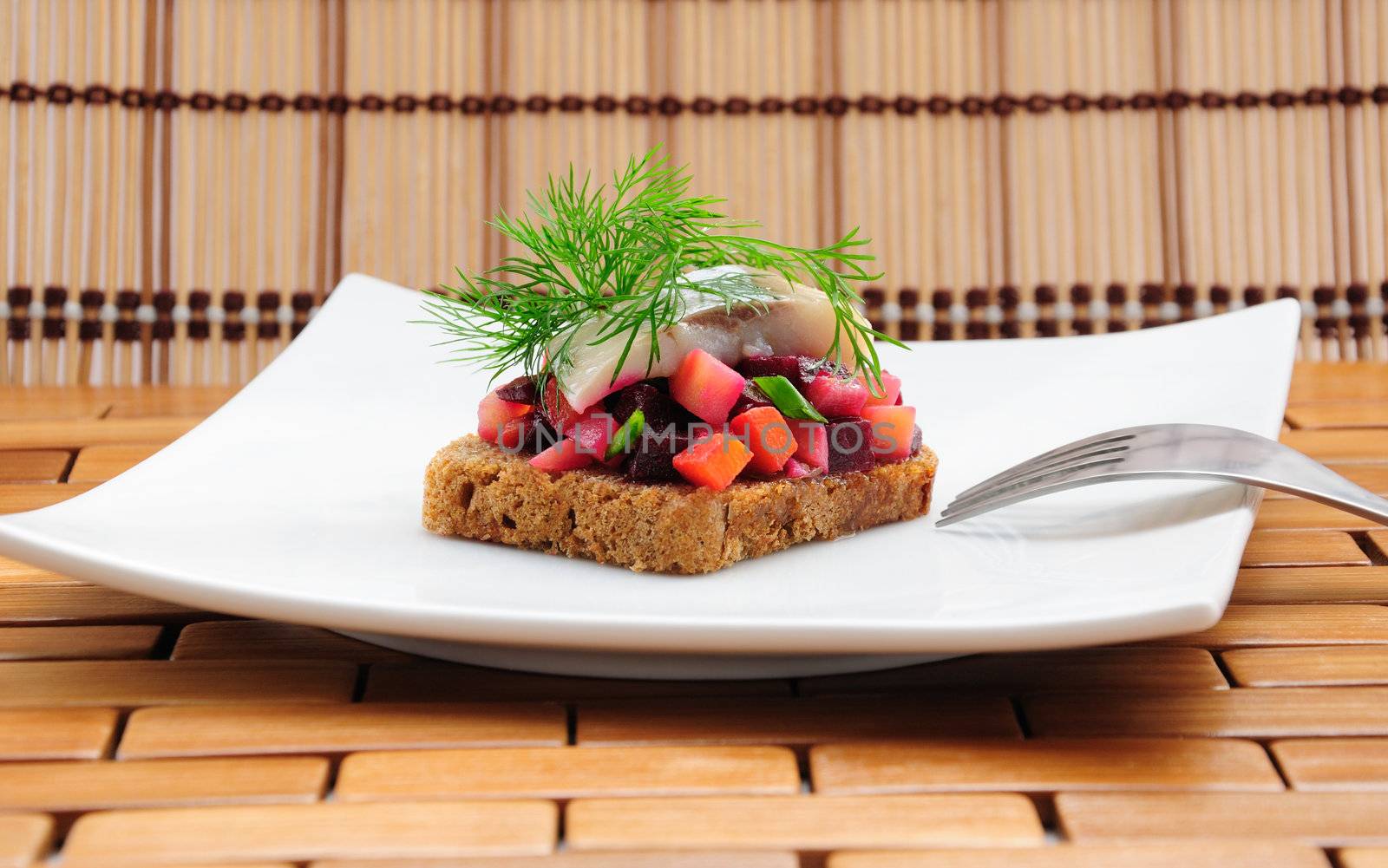 Sandwiches with rye bread, herring and vegetables