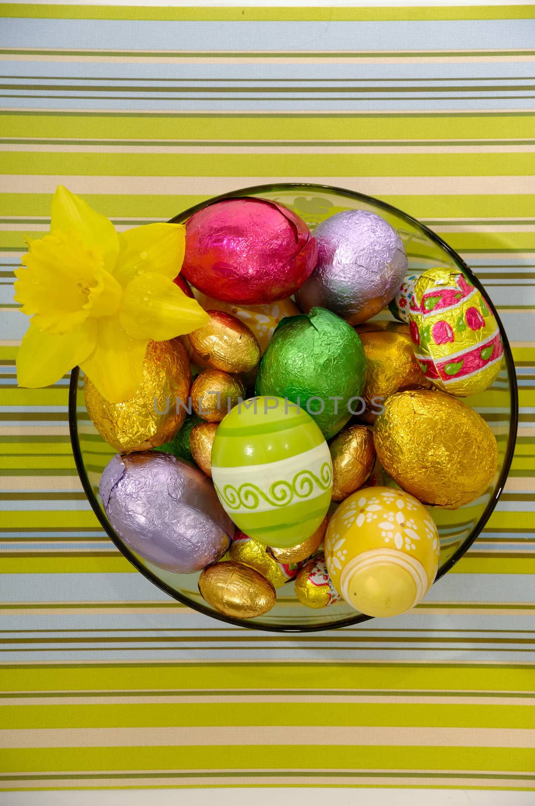Easter eggs and flower in bowl.