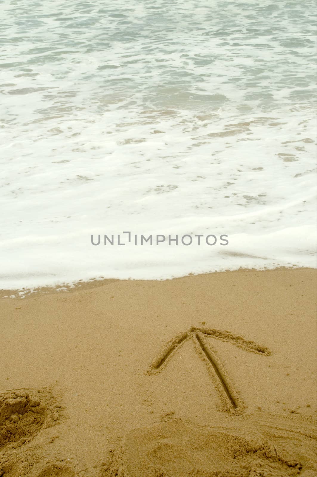 Arrow writen in the sand