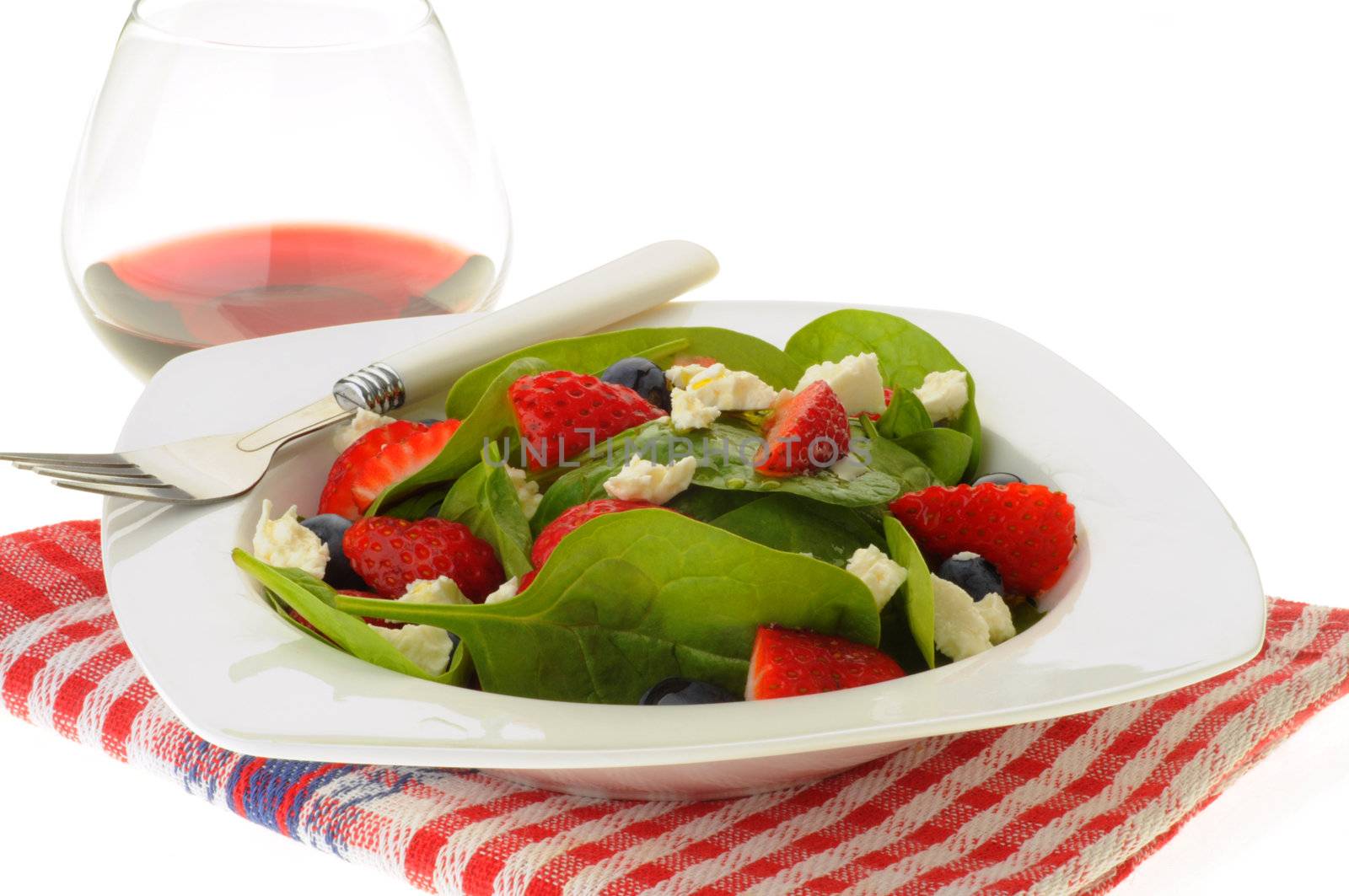 Colorful salad with strawberry, blueberry and feta.